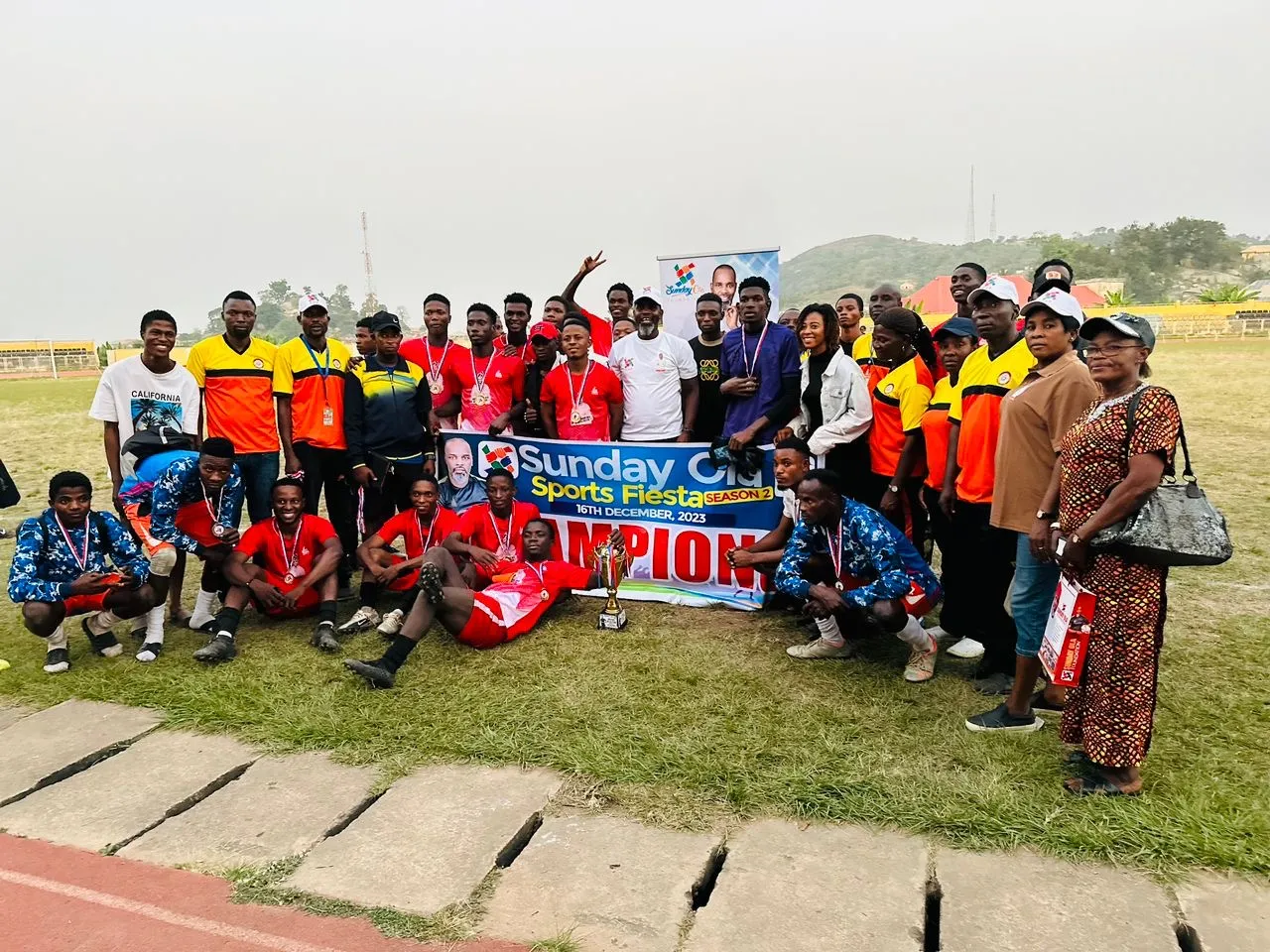 Photo: EKSU Galacticos players and management celebrating with the trophy. Credit: Aduragbemi Joshua/Made In Africa Sport