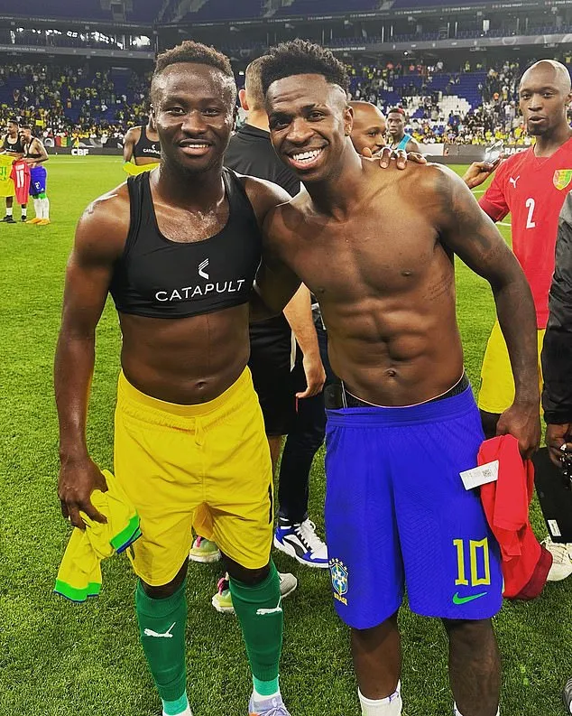 Morlaye Sylla swapping shirts with Brazilian star Vinicius Jr after a friendly last summer