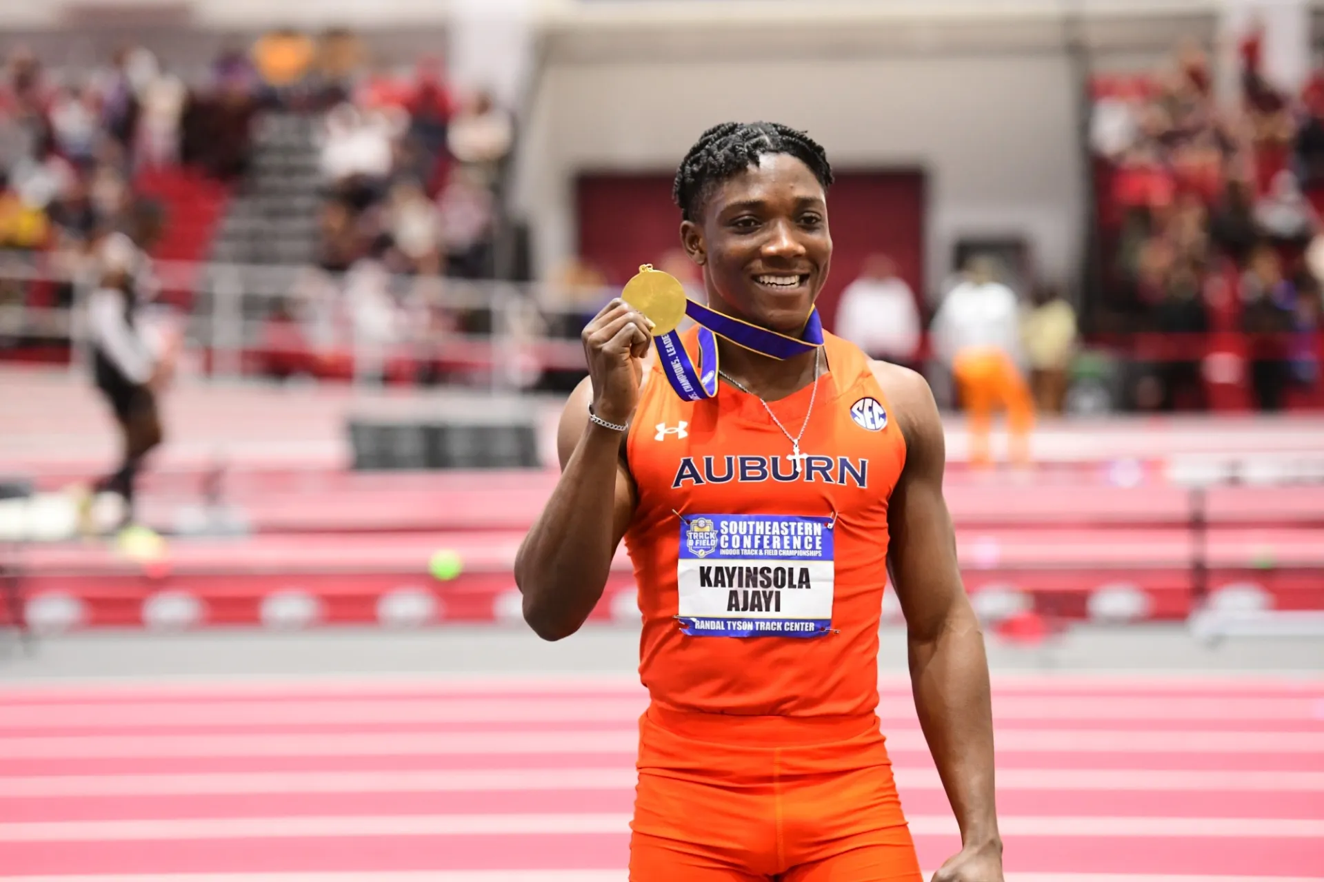 Photo: Kanyinsola Ajayi after winning the men’s 60m final. (Credit: AuburnTXFC)
