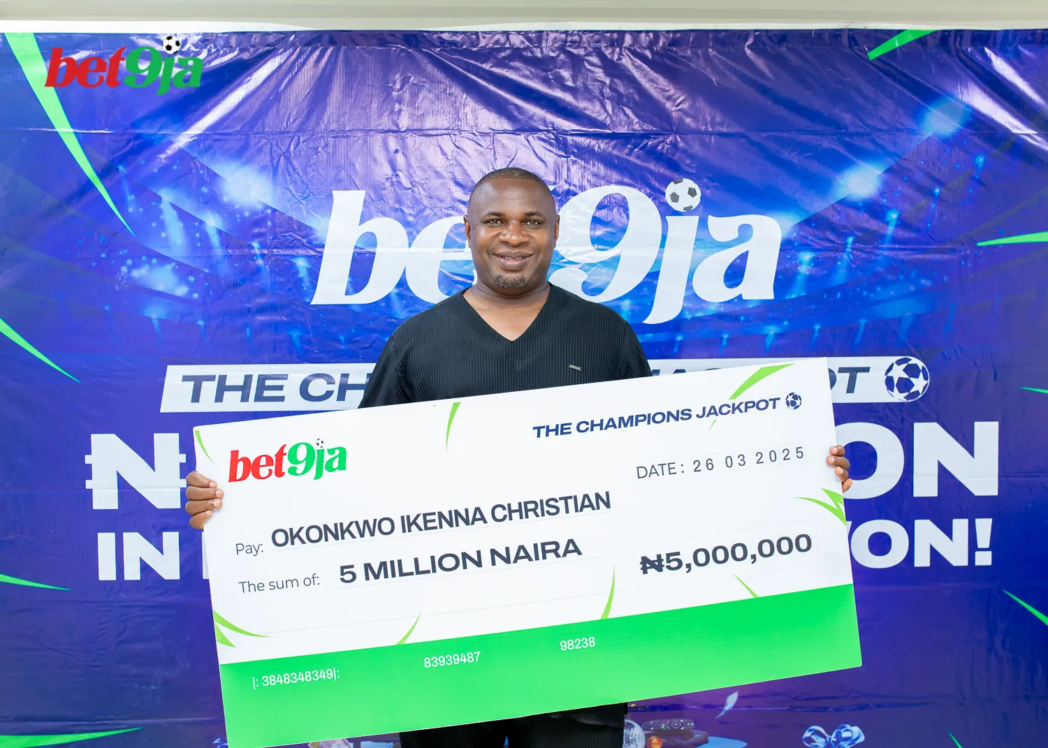 Millionaire Emerges From The Bet9Ja Ucl Jackpot Campaign 2 Photo: Okonkwo Ikenna Christian Poses With His Cheque After Winning ₦5 Million In The Bet9Ja Ucl Jackpot Campaign On 26 March 2025. (Credit: Bet9Ja)