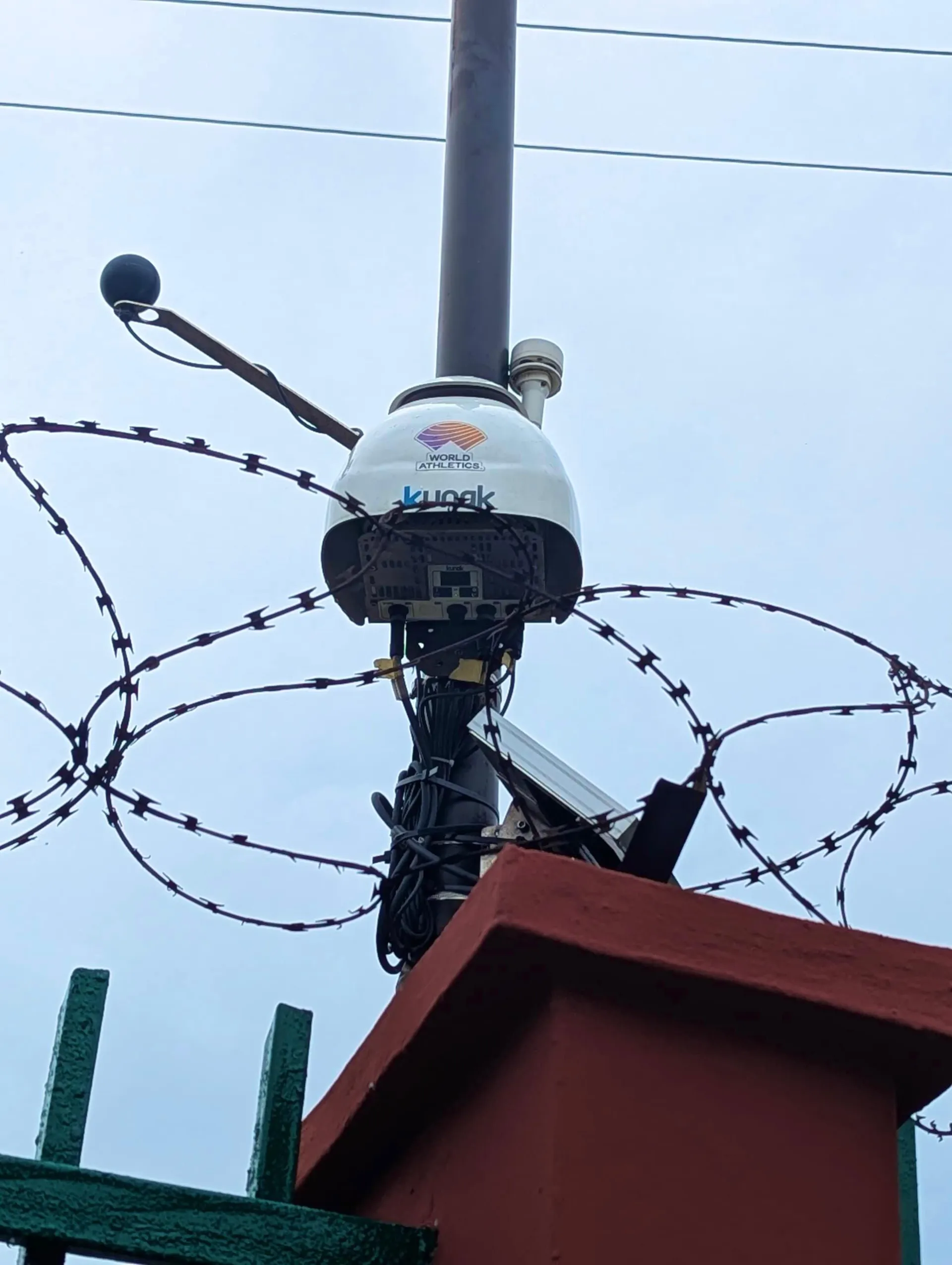 Nilayo Sports Deliver World Athletics Air Monitor To Lagos State 2 The World Athletics Air Quality Monitoring Device Mounted Over A Fence