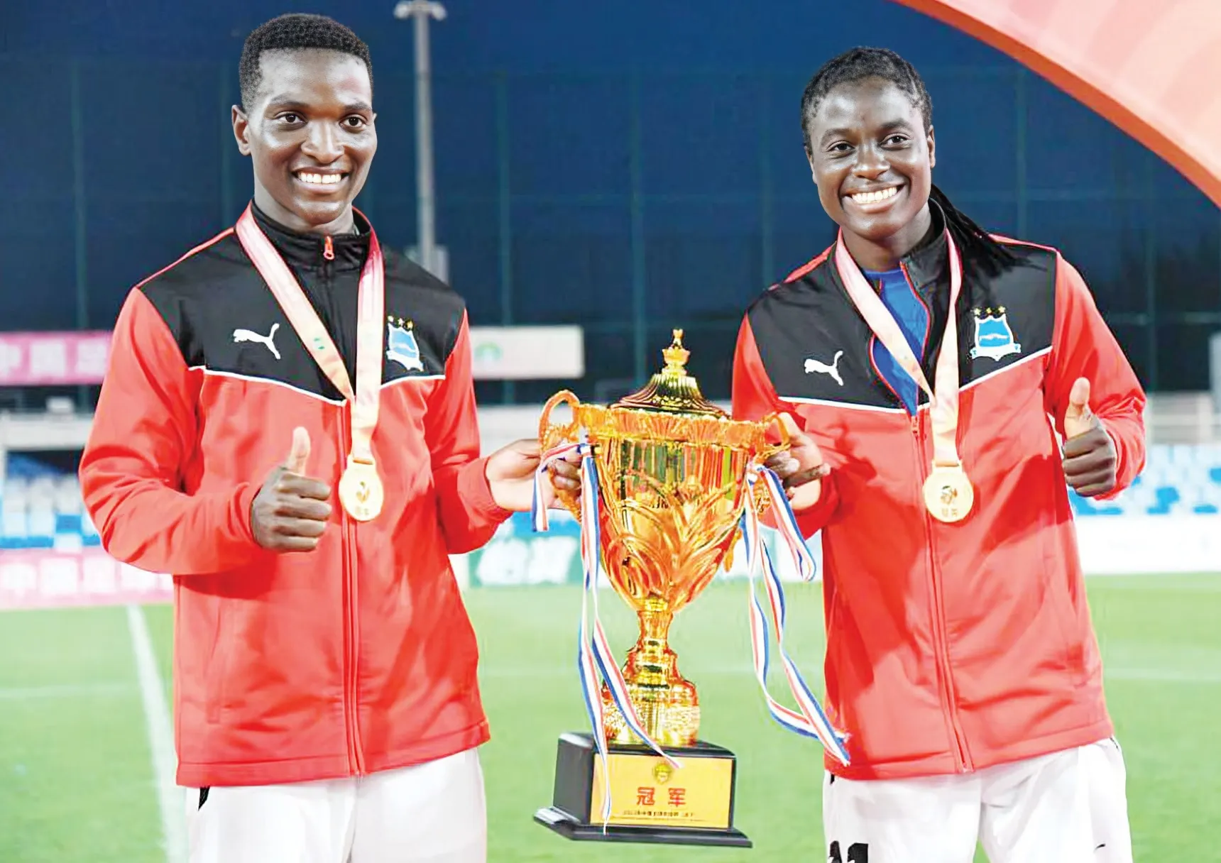 Photo: Malawi’s Temwa (left) and Tabitha Chawinga (right) celebrate winning the 2023 Chinese Football Association Cup after leading Wuhan Jiangda University FC to victory in the final. (Credit: @tabitha.chawinga/Instagram)