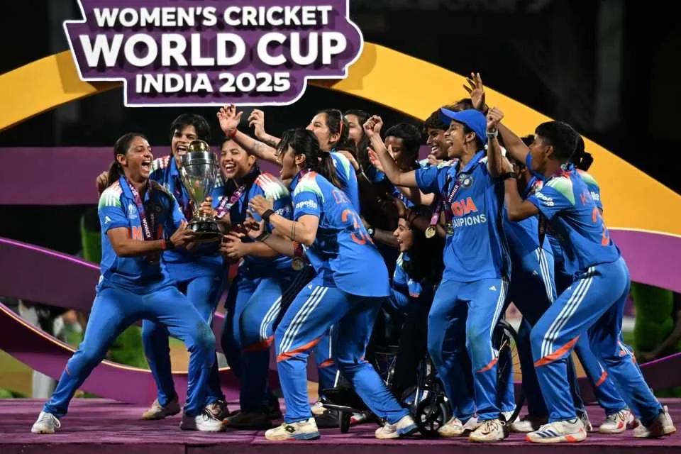 The Indian team lifts the World Cup Trophy • ICC/Getty Images