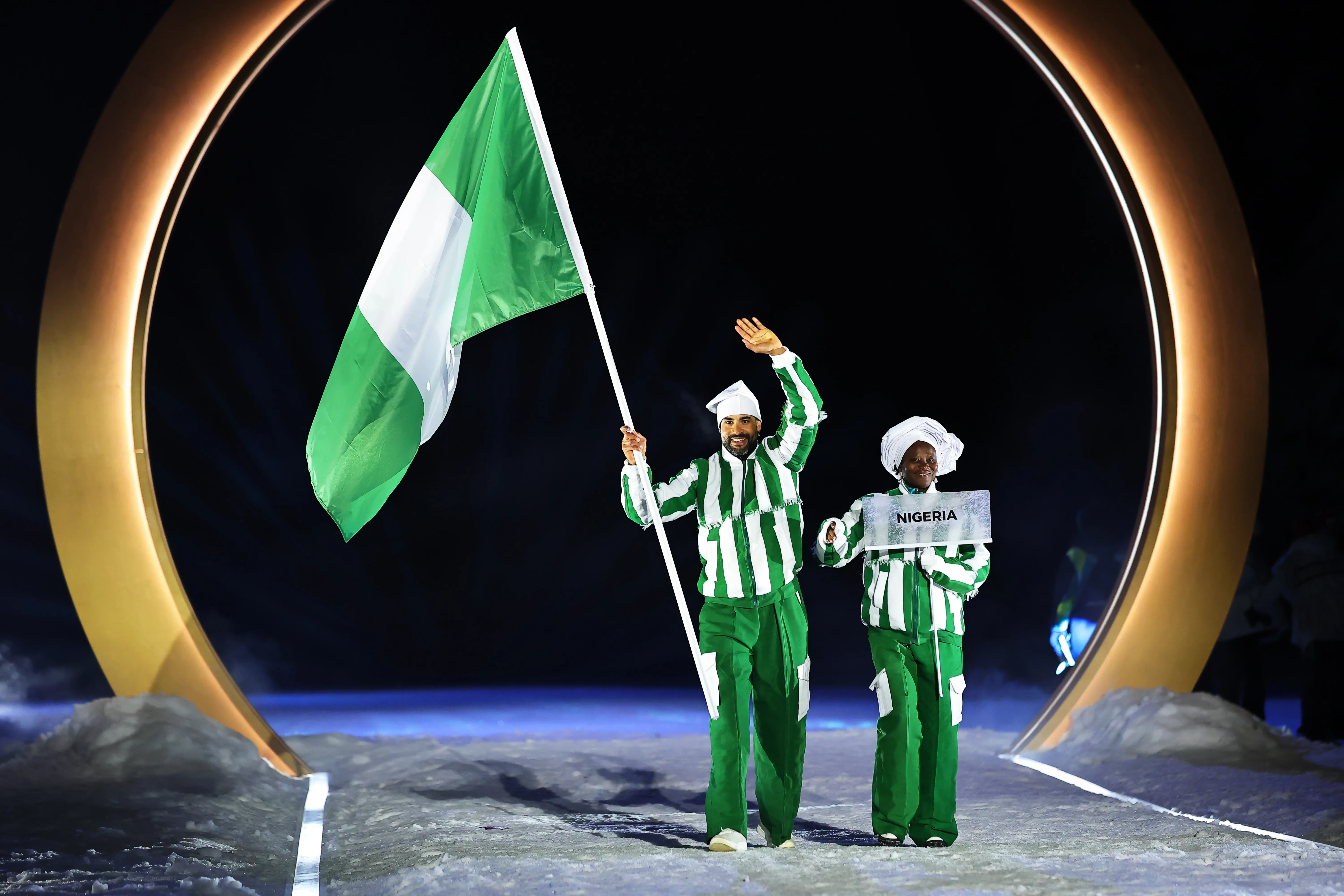 Olympic Winter Games Milan Cortina 2026, Opening Ceremony In Predazzo, The Team From Nigeria Is Led By Flag Bearer Samuel Uduigowme Ikpefan. Photo Credit: Getty Images