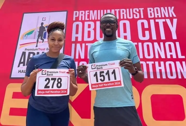 Two Participants Pose With Their Race Bibs Ahead Of The Abuja Half Marathon 2024 At The Abuja City International Marathon 0Aphoto Credit Premium Trust Bankabuja City International Marathon
